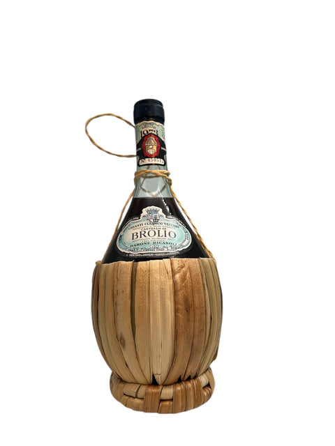 Bottle of Chianti Brolio 1978 in traditional straw basket