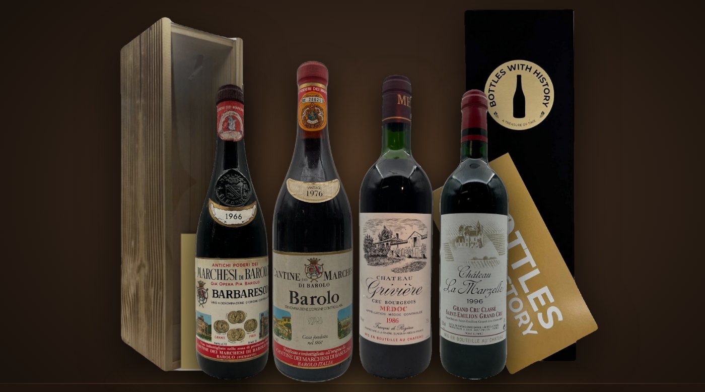 Årgangsvine fra 1966, 1976, 1986 og 1996 foran Bottles With History-gaveæsker i træ og sort